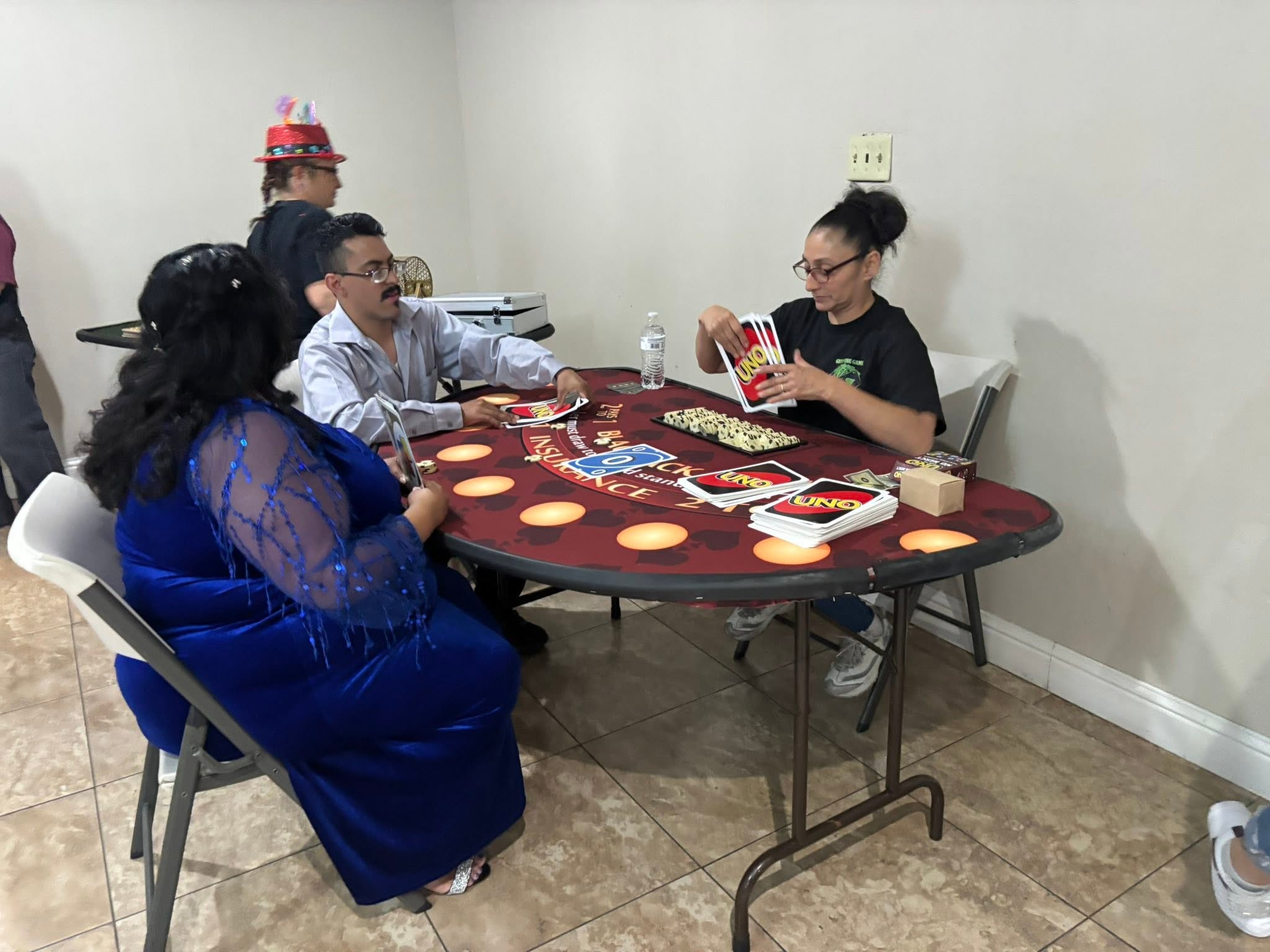 Guests enjoying a group game around a casino-style table